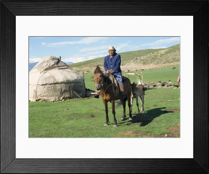 Framed Print : Kazak woman on horseback beside a yurt in the Altay mountains, north east Xinjiang Framed Print : Kazak woman on horseback beside a yurt in the Altay mountains, north east Xinjiang