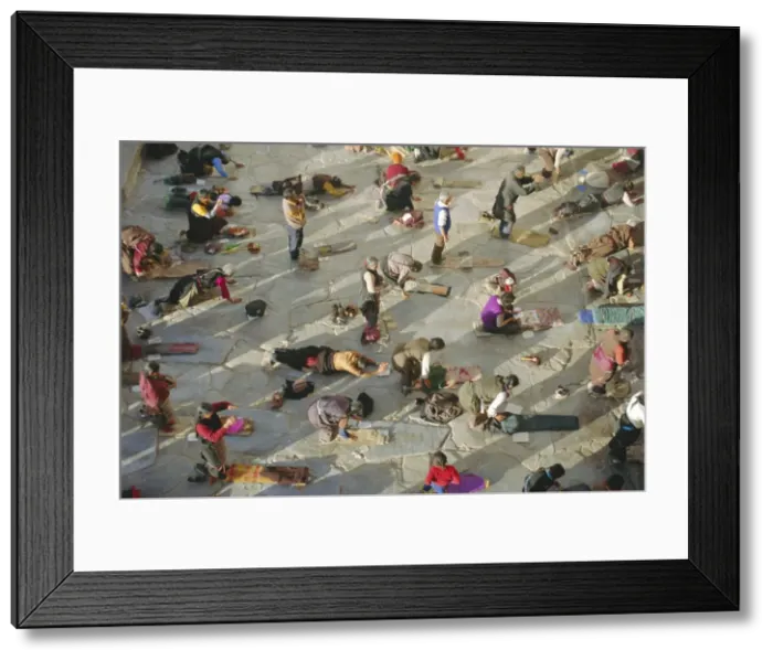 Framed Print : Buddhist pilgrims prostrating, Barkhor Jokhang Temple, Lhasa, Tibet, China Framed Print : Buddhist pilgrims prostrating, Barkhor Jokhang Temple, Lhasa, Tibet, China