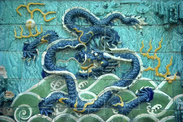 Dragons on tiles on the Dragon wall in the Forbidden City in Beijing, China, Asia