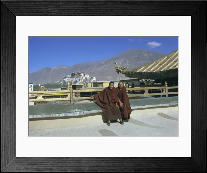 Framed Print : Two Tibetan Buddhist monks at Jokhang temple, with the Potala palace behind Framed Print : Two Tibetan Buddhist monks at Jokhang temple, with the Potala palace behind