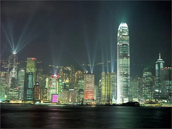 Hong Kong city skyline looking across Victoria harbour to Hong Kong Island at night