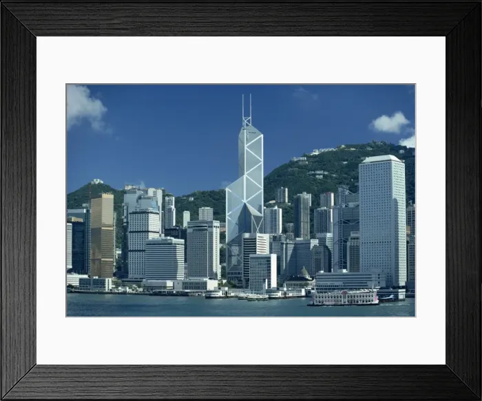 Framed Print : The city skyline from the harbour with the Bank of China in the centre on Hong Kong Island Framed Print : The city skyline from the harbour with the Bank of China in the centre on Hong Kong Island