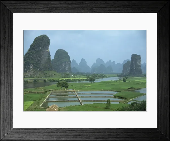 Framed Print : Landscape of rice paddies, fish farms and limestone pinnacles in the Fenglin Karst south of Guilin Framed Print : Landscape of rice paddies, fish farms and limestone pinnacles in the Fenglin Karst south of Guilin