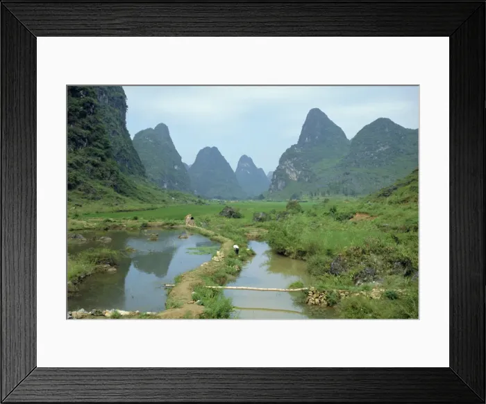 Framed Print : In Guilin, irrigation channel among rice paddies in area of limestone towers Framed Print : In Guilin, irrigation channel among rice paddies in area of limestone towers