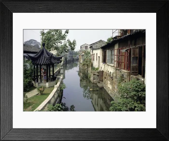 Framed Print : Venice of the East, one of the many canals still in use, lined with typical houses Framed Print : Venice of the East, one of the many canals still in use, lined with typical houses