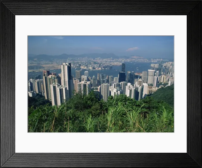 Framed Print : View from Victoria Peak over the city skyline of Hong Kong Island to Kowloon in the distance Framed Print : View from Victoria Peak over the city skyline of Hong Kong Island to Kowloon in the distance