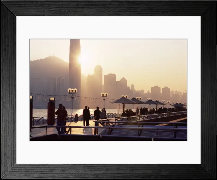 Framed Print : Avenue of Stars, Tsim Sha Tsui, Kowloon, with Victoria Harbour and skyline of Hong Kong Island in the background at dusk, Hong Kong Framed Print : Avenue of Stars, Tsim Sha Tsui, Kowloon, with Victoria Harbour and skyline of Hong Kong Island in the background at dusk, Hong Kong