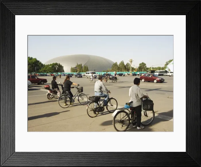 Framed Print : The National Theatre designed by the French architect Paul Andreu, and cyclists commuting in central Beijing, Beijing Framed Print : The National Theatre designed by the French architect Paul Andreu, and cyclists commuting in central Beijing, Beijing
