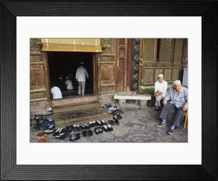 Framed Print : Men praying and shoes left outside at The Great Mosque located in the Muslim Quarter home to the citys Hui community, Xian City, Shaanxi Province Framed Print : Men praying and shoes left outside at The Great Mosque located in the Muslim Quarter home to the citys Hui community, Xian City, Shaanxi Province