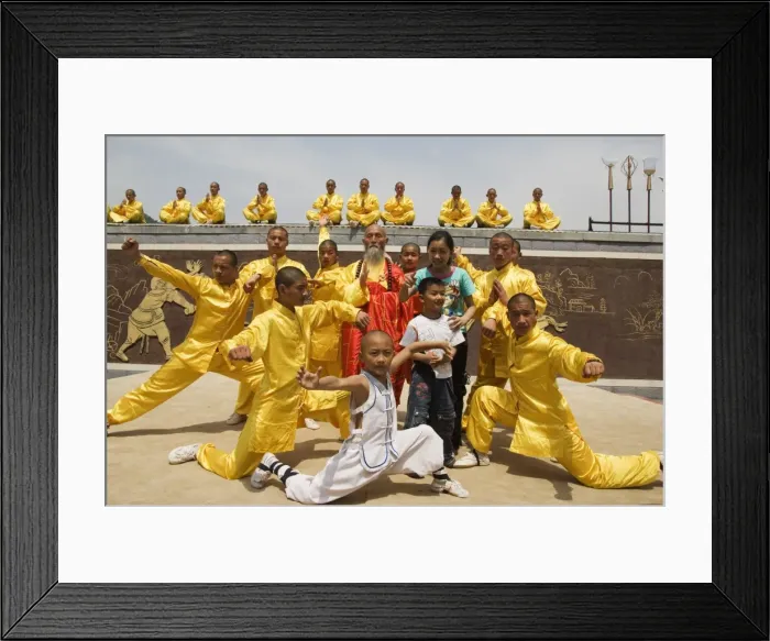 Framed Print : Kung fu students displaying their skills at a tourist show within Shaolin Temple Framed Print : Kung fu students displaying their skills at a tourist show within Shaolin Temple