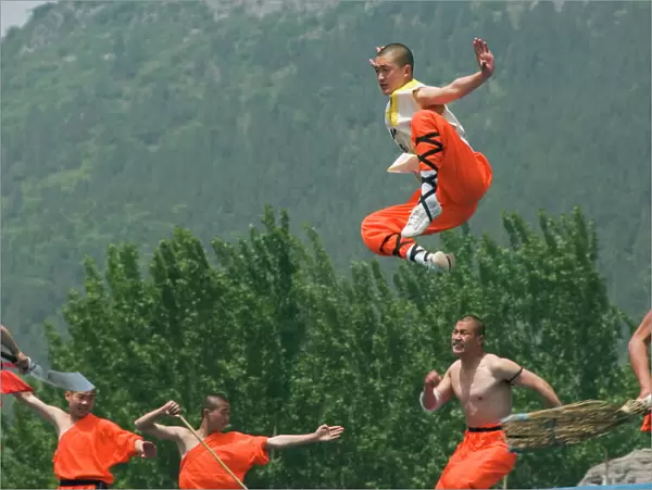 Kung fu students displaying their skills at a tourist show within Shaolin Temple