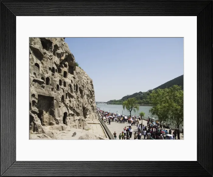 Framed Print : Carved Buddha images at Longmen Caves, Dragon Gate Grottoes, on the Yi He River dating from the 6th to 8th Centuries, UNESCO World Heritage Site, Henan Province Framed Print : Carved Buddha images at Longmen Caves, Dragon Gate Grottoes, on the Yi He River dating from the 6th to 8th Centuries, UNESCO World Heritage Site, Henan Province