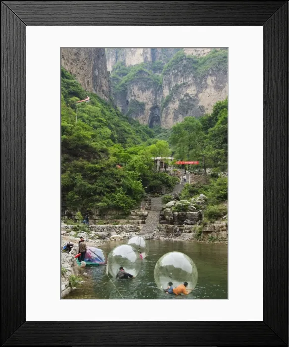 Framed Print : Children playing on river inflatables, Wan Xian mountain recreation area Framed Print : Children playing on river inflatables, Wan Xian mountain recreation area