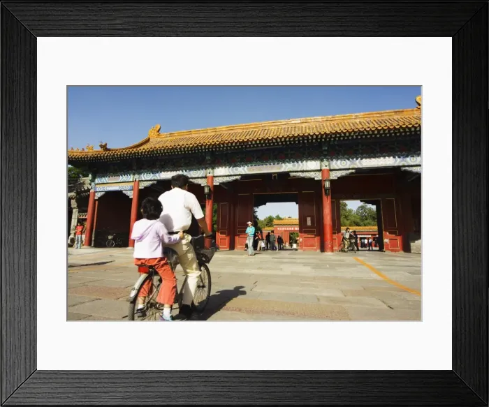 Framed Print : A cyclist at a gate to Zijin Cheng The Forbidden City Palace Museum, UNESCO World Heritage Site Framed Print : A cyclist at a gate to Zijin Cheng The Forbidden City Palace Museum, UNESCO World Heritage Site