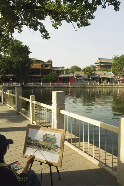 An artist painting at Houhai Lake, Beijing, China, Asia