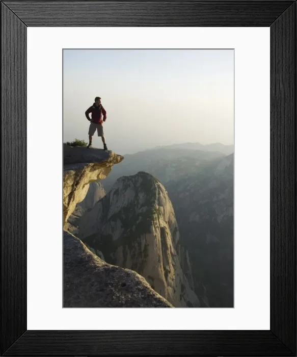 Framed Print : Foreign tourist admiring the view on Hua Shan, a granite peaked mountain of 2160m Framed Print : Foreign tourist admiring the view on Hua Shan, a granite peaked mountain of 2160m