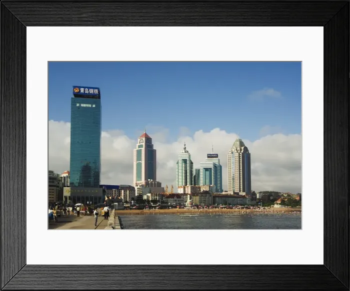 Framed Print : Modern skyscrapers in the seaside beach resort and host of the sailing events of the 2008 Olympic Games, Qingdao, Shandong Province Framed Print : Modern skyscrapers in the seaside beach resort and host of the sailing events of the 2008 Olympic Games, Qingdao, Shandong Province