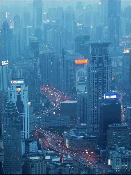 Car light trails and illuminated buildings leading from the Bund, Shanghai, China, Asia
