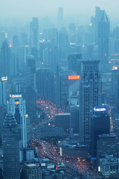 Car light trails and illuminated buildings leading from the Bund, Shanghai, China, Asia