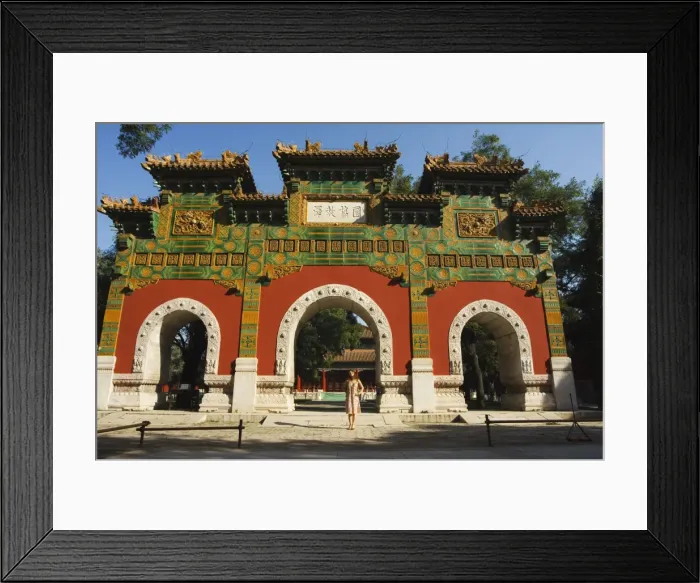 Framed Print : Chinese girl under a glazed archway at the Confucius Temple Imperial College built in 1306 by the grandson of Kublai Khan administering the official Confucian examination system, Beijing