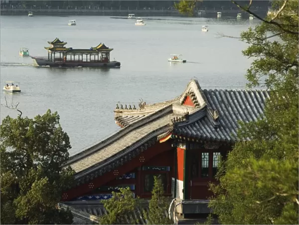 Chinese style boats on a lake in Beihai Park, Beijing, China, Asia