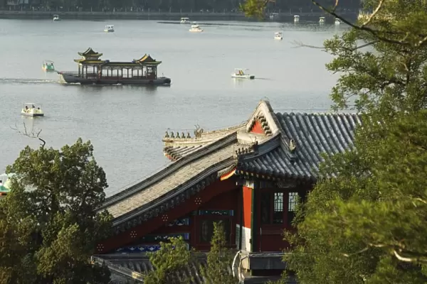 Chinese style boats on a lake in Beihai Park, Beijing, China, Asia