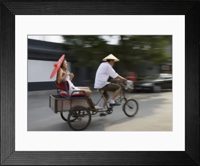 Framed Print : Asian woman (Chinese-Thai) riding in cycle rickshaw, Hutong District, Beijing Framed Print : Asian woman (Chinese-Thai) riding in cycle rickshaw, Hutong District, Beijing