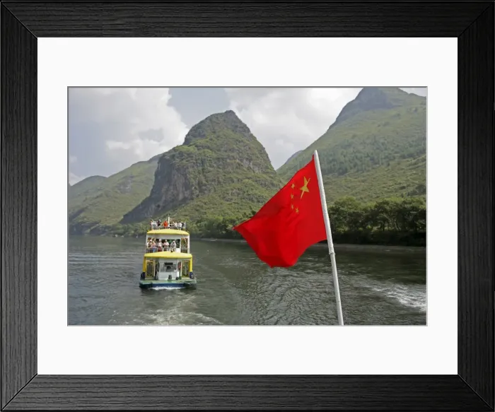 Framed Print : Cruise boat with Chinese flag on Li River between Guilin and Yangshuo, Guilin