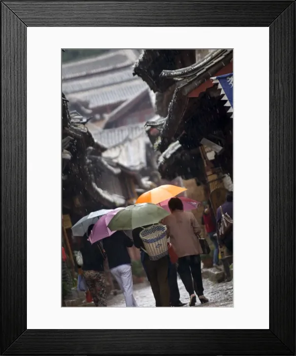 Framed Print : Locals with umbrellas in rain, Lijiang old town, UNESCO World Heritage Site Framed Print : Locals with umbrellas in rain, Lijiang old town, UNESCO World Heritage Site
