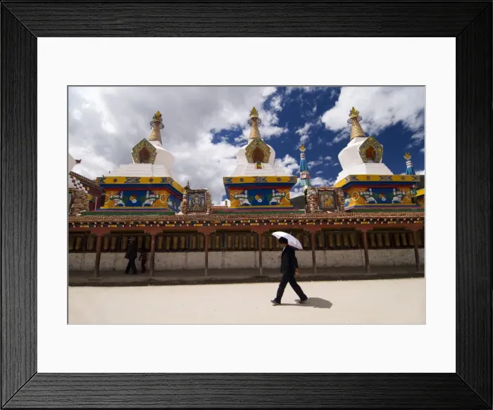 Framed Print : Man with umbrella at temple, Yushu, Qinghai, China, Asia Framed Print : Man with umbrella at temple, Yushu, Qinghai, China, Asia
