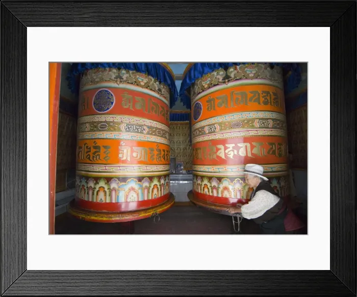 Framed Print : Old woman pushing prayer wheels, Jingang Si, Kangding, Sichuan, China, Asia Framed Print : Old woman pushing prayer wheels, Jingang Si, Kangding, Sichuan, China, Asia