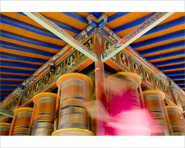 Spinning prayer wheels, Xiahe monastery, Xiahe, Gansu, China, Asia