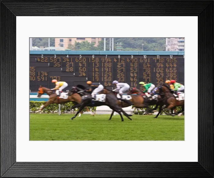 Framed Print : Horses race past large scoreboard during race at Happy Valley racecourse Framed Print : Horses race past large scoreboard during race at Happy Valley racecourse