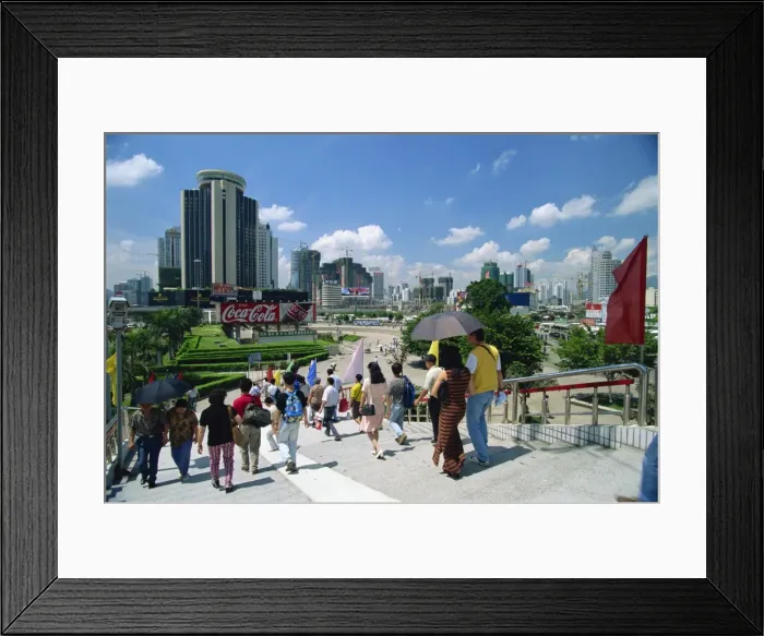 Framed Print : Street scene of pedestrian walkway in the centre of Shenzhen City in the Special Economic Zone boomtown on border with Hong Kong Framed Print : Street scene of pedestrian walkway in the centre of Shenzhen City in the Special Economic Zone boomtown on border with Hong Kong