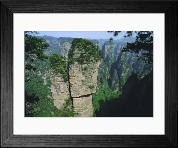 Framed Print : Spectacular limestone outcrops and forested valleys of Zhangjiajie Forest Park in the Wulingyuan Scenic Area, Hunan Framed Print : Spectacular limestone outcrops and forested valleys of Zhangjiajie Forest Park in the Wulingyuan Scenic Area, Hunan