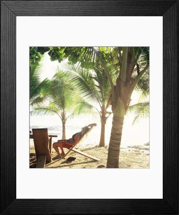 Framed Print : Young woman relaxes on Avellans Beach, Costa Rica, Central America Framed Print : Young woman relaxes on Avellans Beach, Costa Rica, Central America