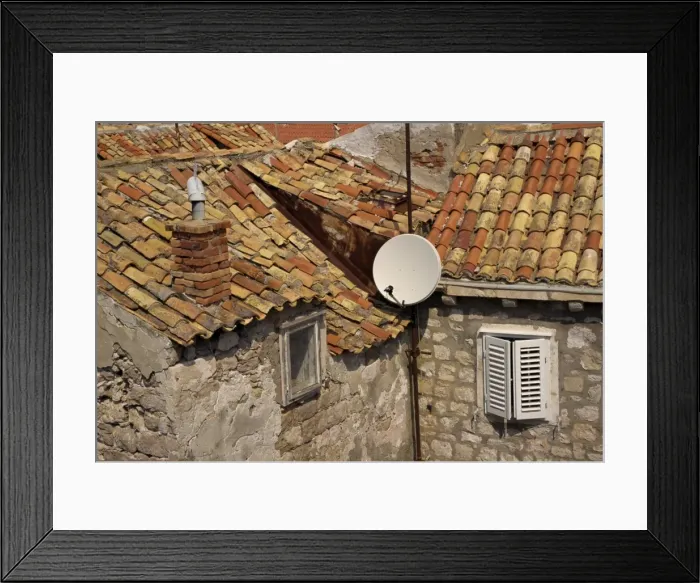 Framed Print : Close-up of roof tiles, old stone walls and satellite dish in the old town of Dubrovnik Framed Print : Close-up of roof tiles, old stone walls and satellite dish in the old town of Dubrovnik