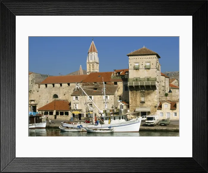 Framed Print : Fishing boats in harbour, with houses and tower beyond in the town of Trogir Framed Print : Fishing boats in harbour, with houses and tower beyond in the town of Trogir