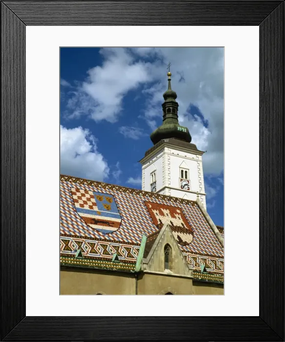 Framed Print : Close-up of tile roof with pattern of shields and clock tower of St. Marks church Framed Print : Close-up of tile roof with pattern of shields and clock tower of St. Marks church
