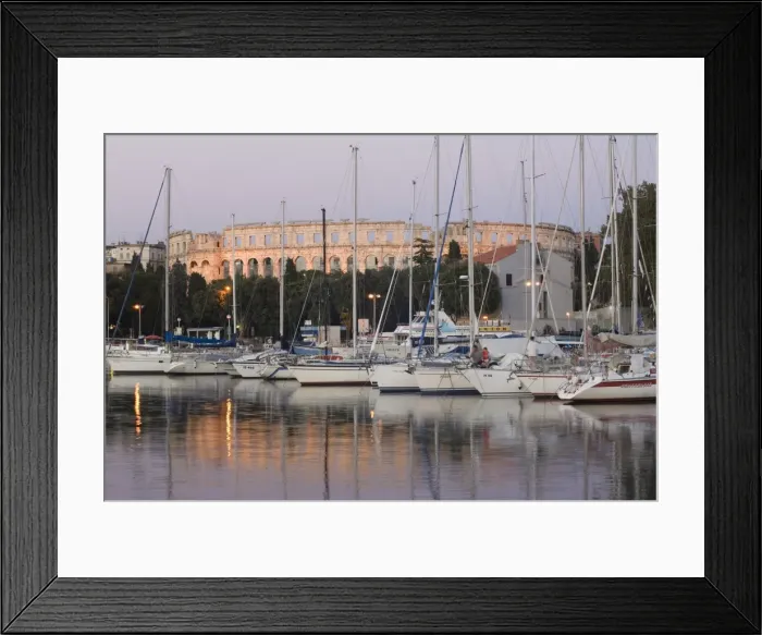 Framed Print : Yachts in the harbour, with the 1st century Roman amphitheatre beyond in evening light Framed Print : Yachts in the harbour, with the 1st century Roman amphitheatre beyond in evening light
