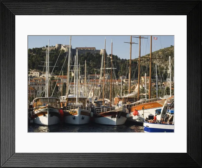 Framed Print : Harbour area and Venetian fortress dating from 1551 on the hill, Hvar Island Framed Print : Harbour area and Venetian fortress dating from 1551 on the hill, Hvar Island