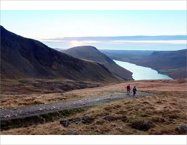 Two men descend from Scafell Pike towards Wast Water, Lake District, Cumbria, England