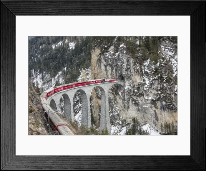 Framed Print : Bernina Express passes over Landwasser Viaduct, UNESCO World Heritage Site, and snowy woods Framed Print : Bernina Express passes over Landwasser Viaduct, UNESCO World Heritage Site, and snowy woods