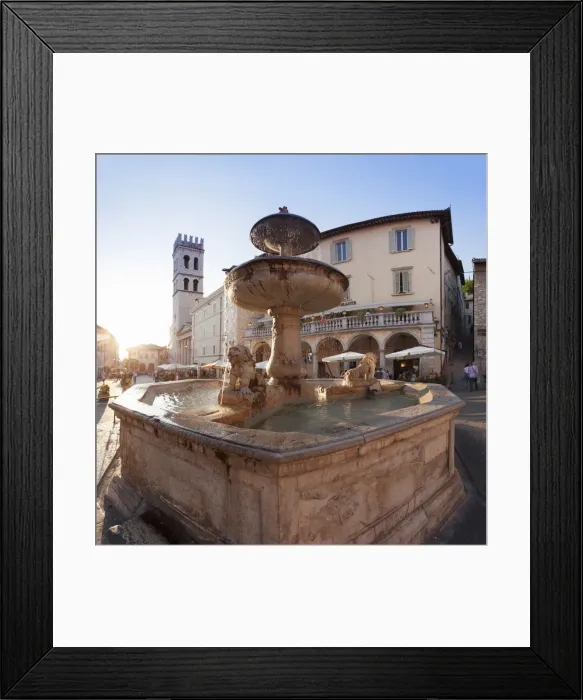 Framed Print : Fountain with Santa Maria sopra Minerva Church, Piazza del Comune Square, Assisi Framed Print : Fountain with Santa Maria sopra Minerva Church, Piazza del Comune Square, Assisi