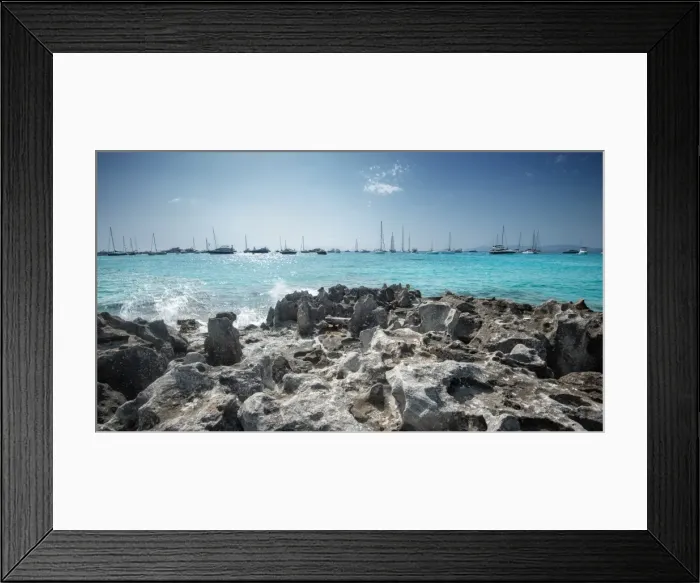 Framed Print : Jagged rocks with sailboats idling in the azure waters of Formentera, Balearic Islands Framed Print : Jagged rocks with sailboats idling in the azure waters of Formentera, Balearic Islands