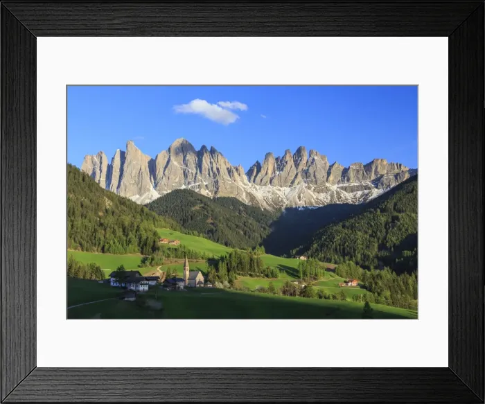 Framed Print : The village of St. Magdalene surrounded by green meadows at the foot of the Odle Framed Print : The village of St. Magdalene surrounded by green meadows at the foot of the Odle