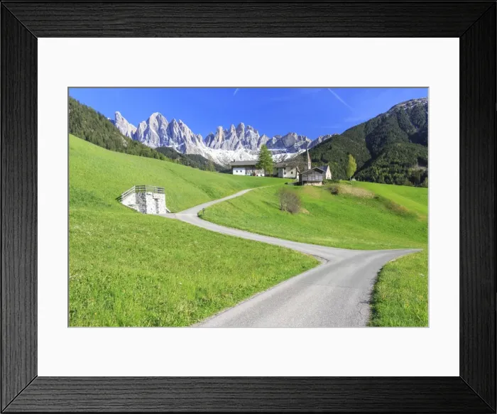 Framed Print : The village of St. Magdalene surrounded by green meadows at the foot of the Odle Framed Print : The village of St. Magdalene surrounded by green meadows at the foot of the Odle