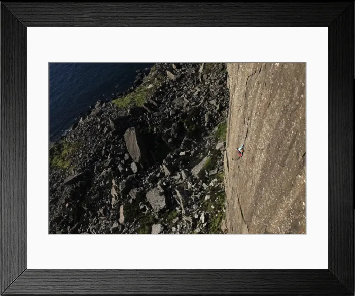 Framed Print : A climber scales the 100 metre cliffs at Fair Head, County Antrim, Ulster, Northern Ireland Framed Print : A climber scales the 100 metre cliffs at Fair Head, County Antrim, Ulster, Northern Ireland
