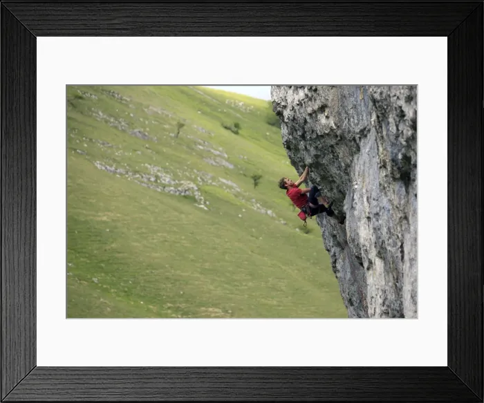 Framed Print : A climber scales a limestone cliff in Upper Wharfedale, Yorkshire Dales National Park Framed Print : A climber scales a limestone cliff in Upper Wharfedale, Yorkshire Dales National Park