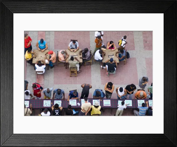 Framed Print : People playing chess and dominoes at a school festival in Parque Cespedes Framed Print : People playing chess and dominoes at a school festival in Parque Cespedes